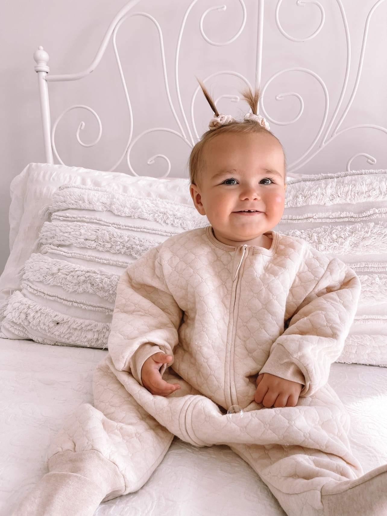 baby wearing 1.0 tog sleepsuit