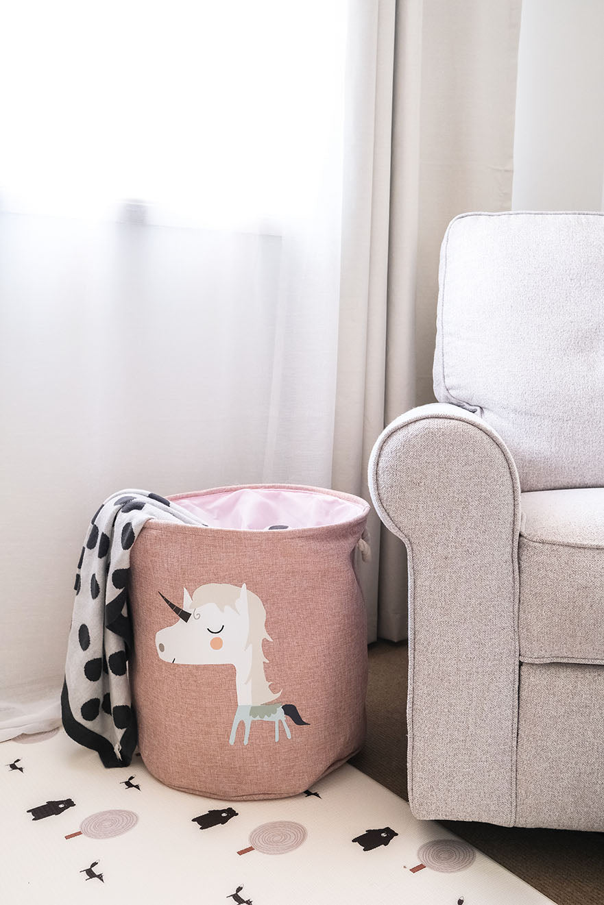 Large stuffed toy storage basket in unicorn design.