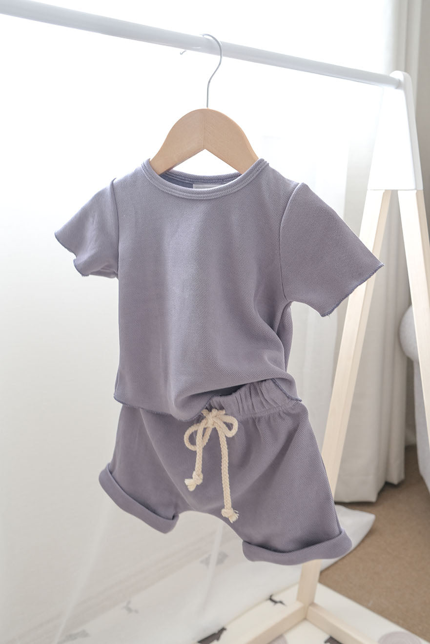 Baby boy clothing set on a hanger