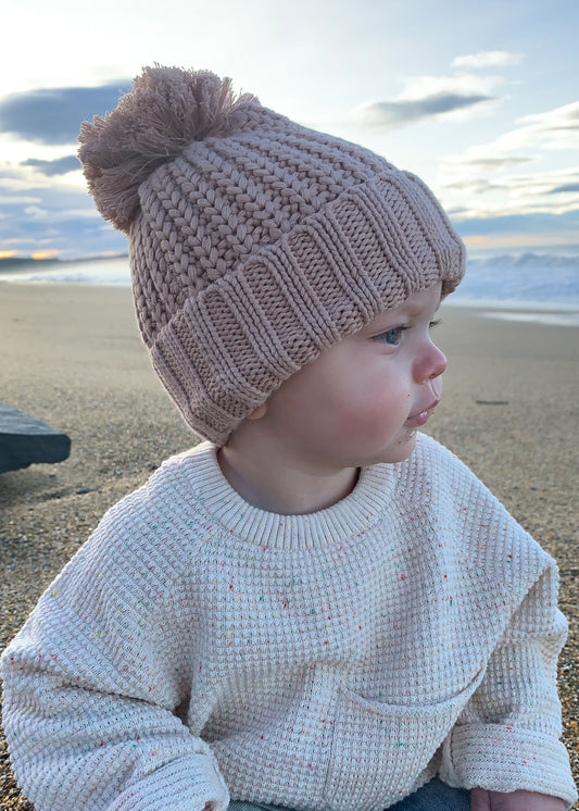 baby wearing brown knitted beanie