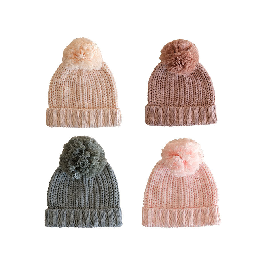 four baby knitted beanies