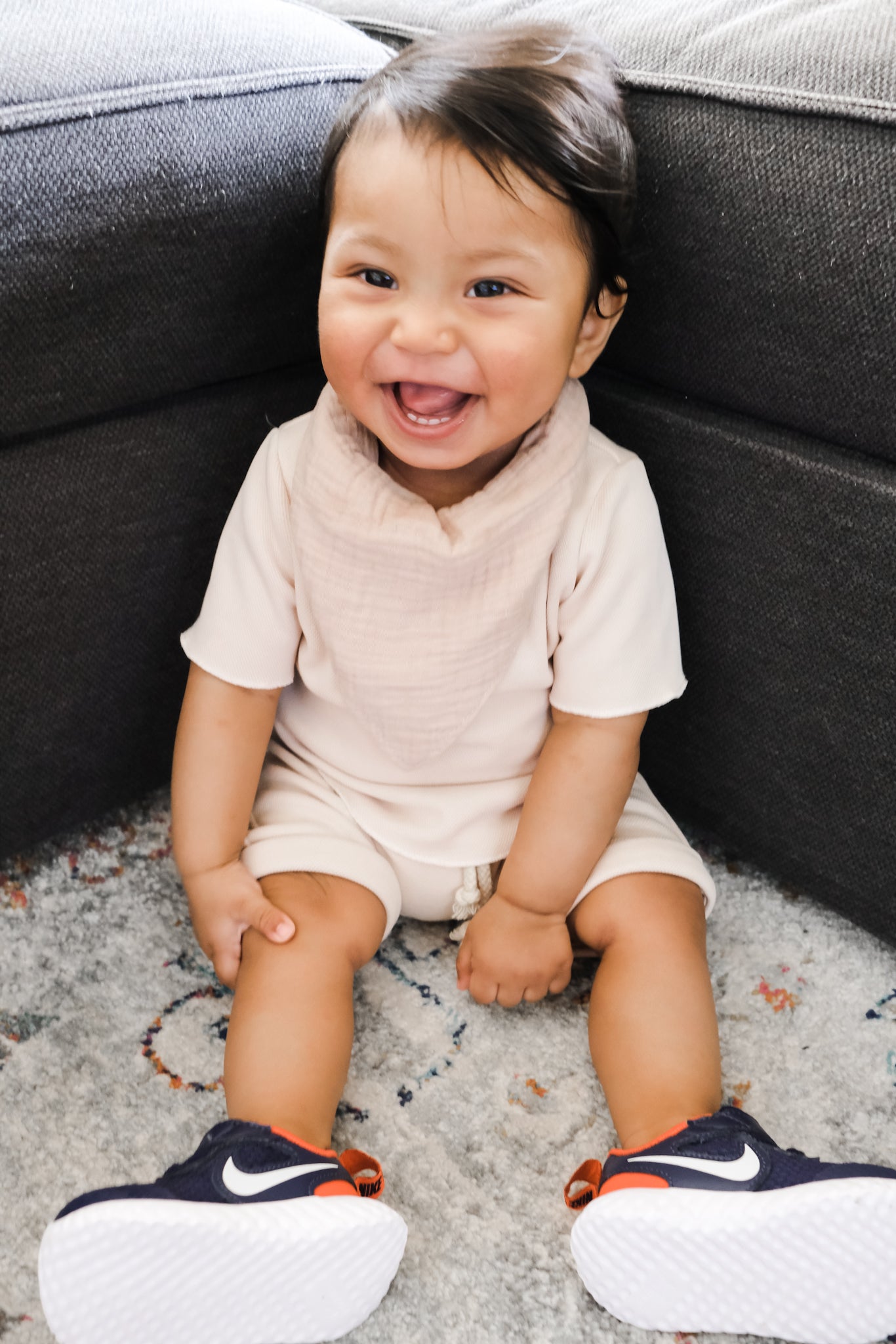 Baby boy wearing beige summer clothing set