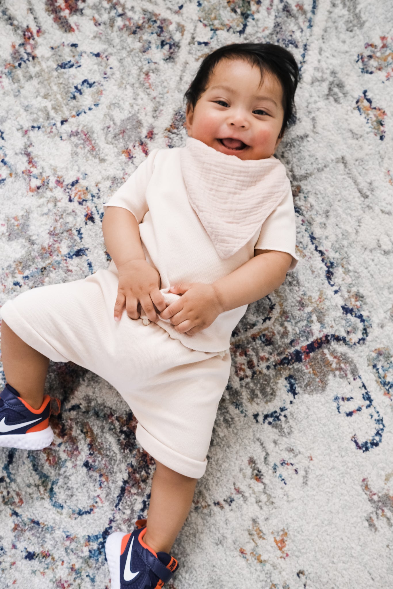 Baby wearing beige clothing set