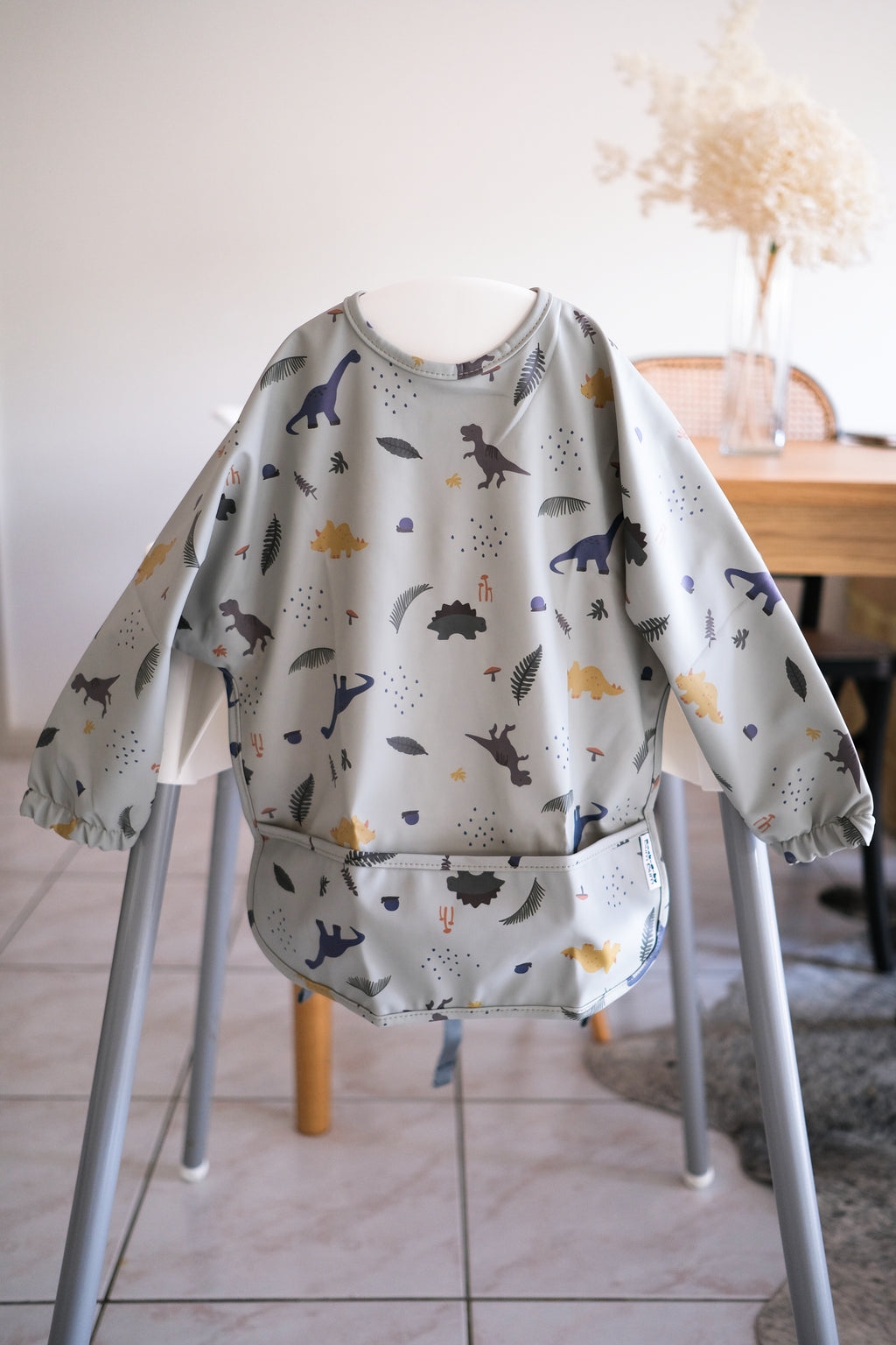 Long sleeve bib in grey dinosaurs design. Baby led weaning bibs