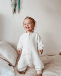 Baby boy wearing sleepsuit with paws pattern