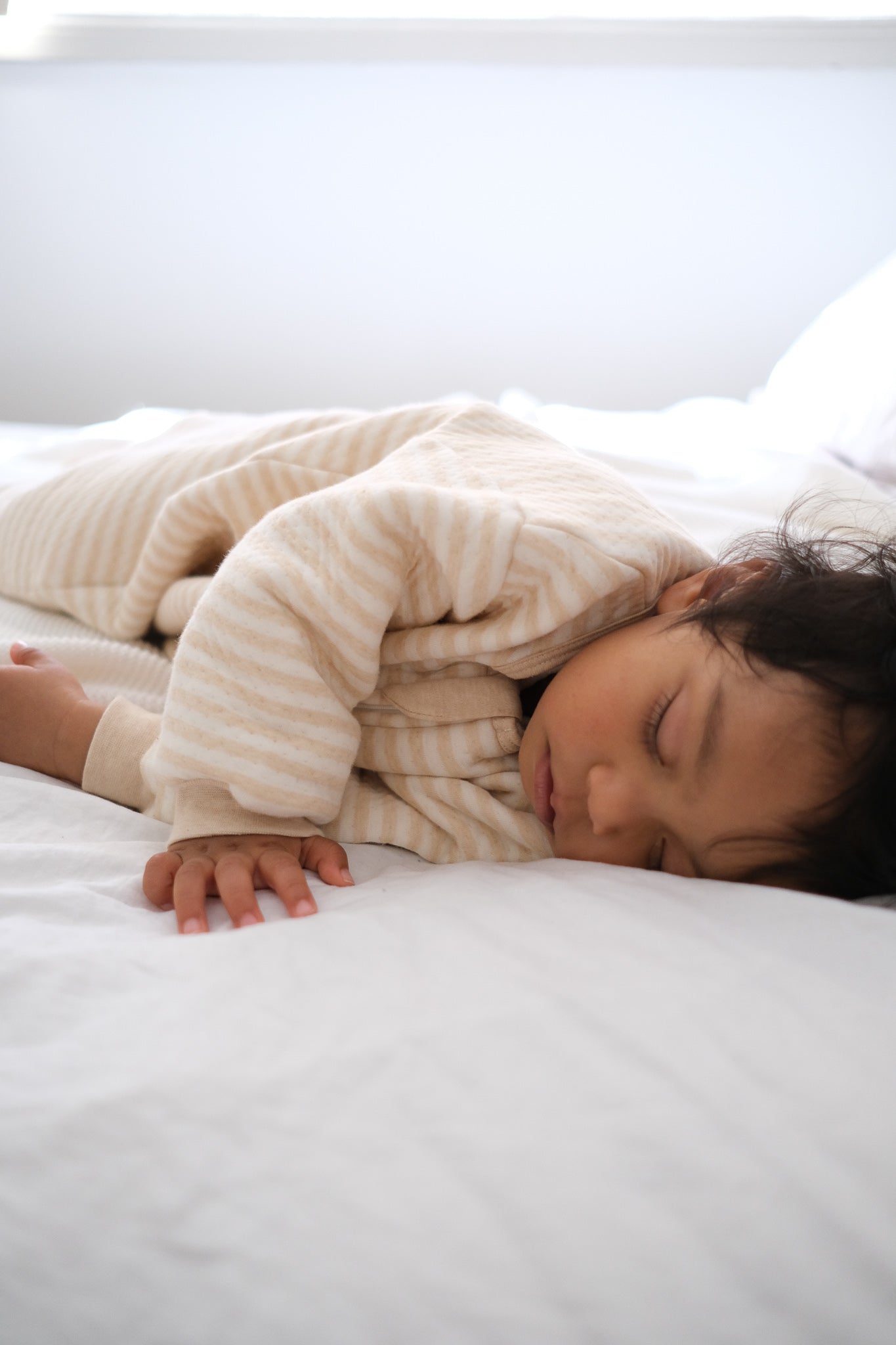 Baby Sleeping wearing sleep suit